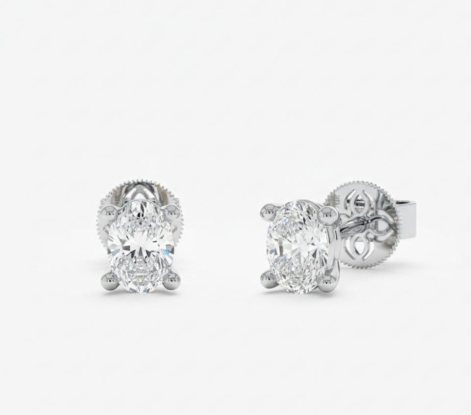 Oval Cut 0.48 CT Diamond Solitaire Stud Earrings in 950 Platinum with Classic Prong Setting Oval Cut 0.48 CT Diamond Solitaire Stud Earrings in 950 Platinum with Classic Prong Setting