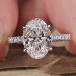 Oval Brilliant Cut 1.50 CT Natural Diamond Solitaire Engagement Ring in 950 Platinum with Pavé Natural Diamond Band