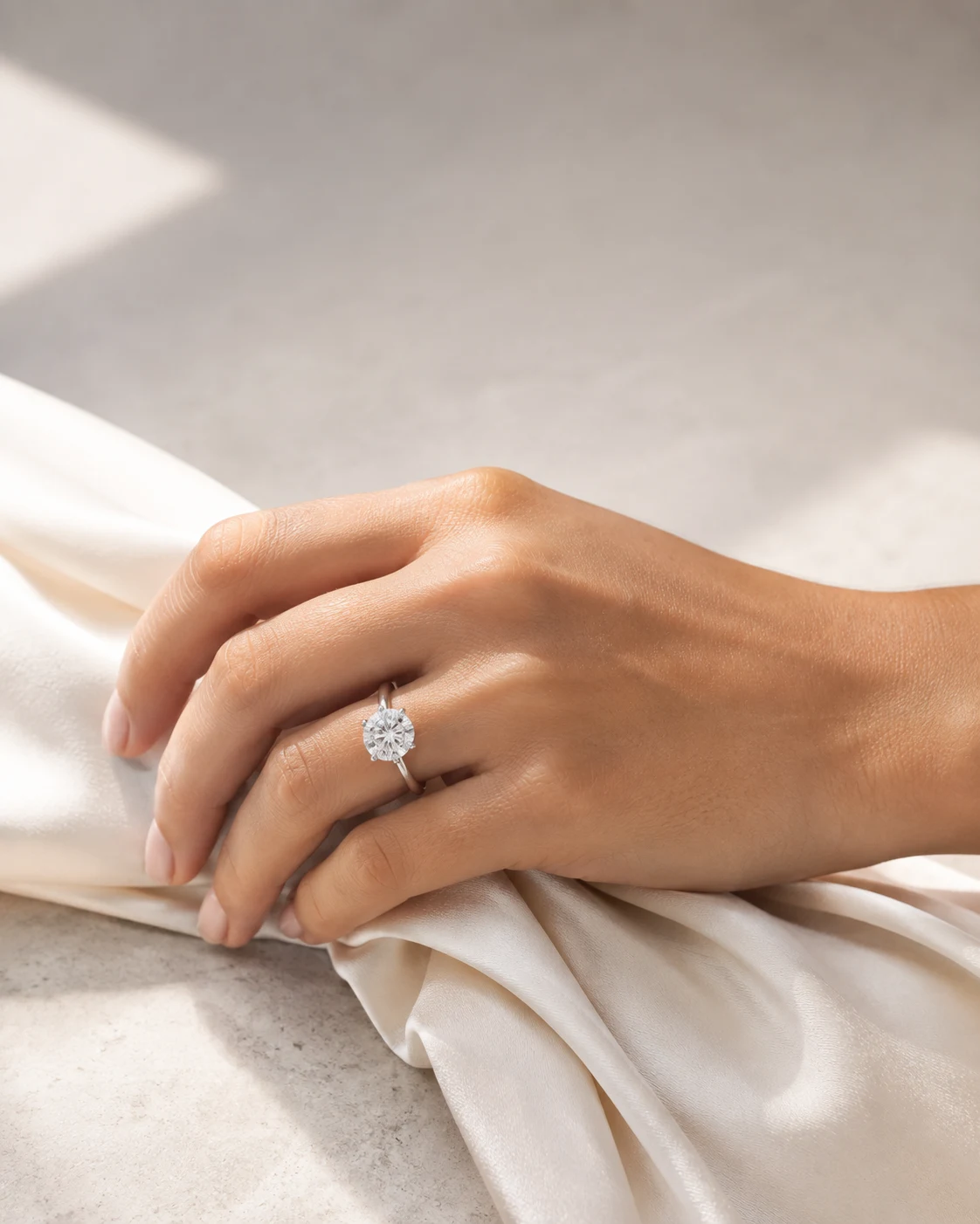 Pt950 platinum engagement ring worn on a hand