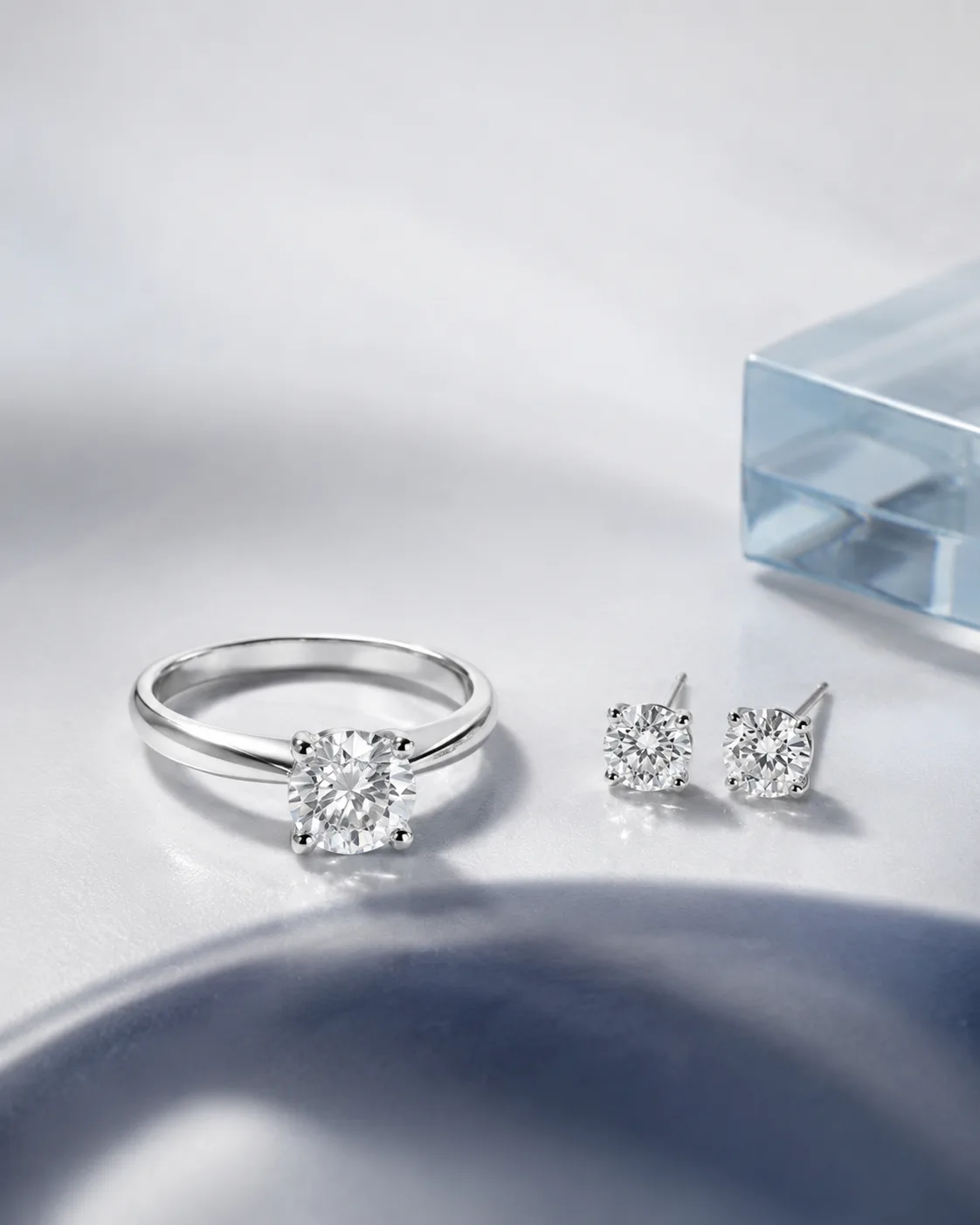 Lab-grown diamond ring and stud earrings set in platinum
