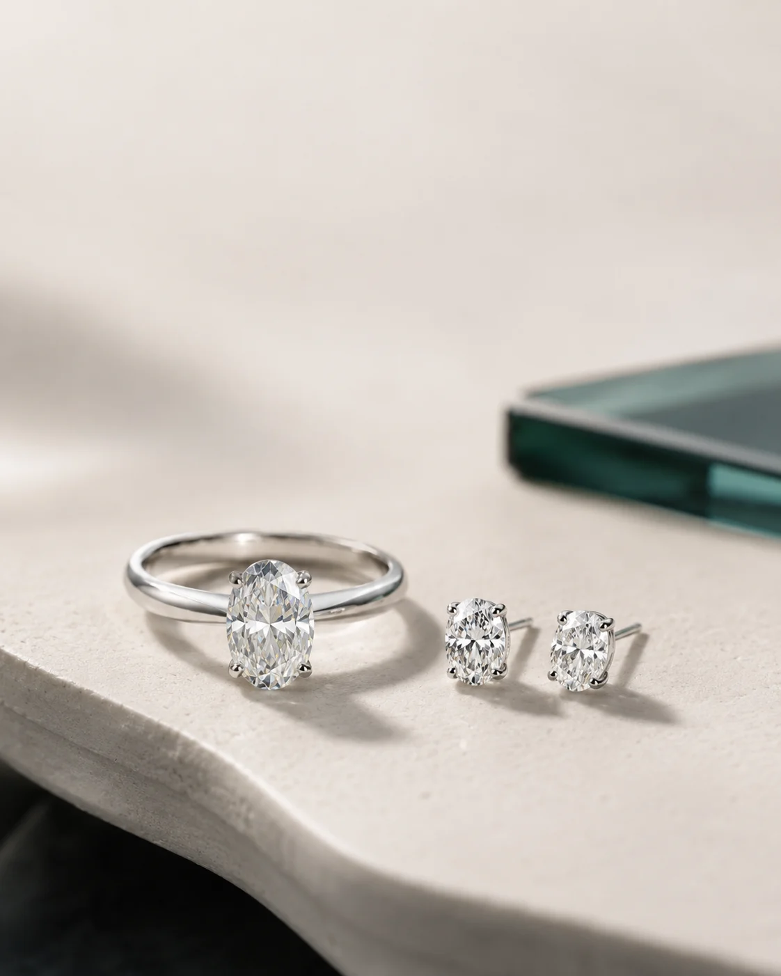 Moissanite ring and stud earrings set in platinum