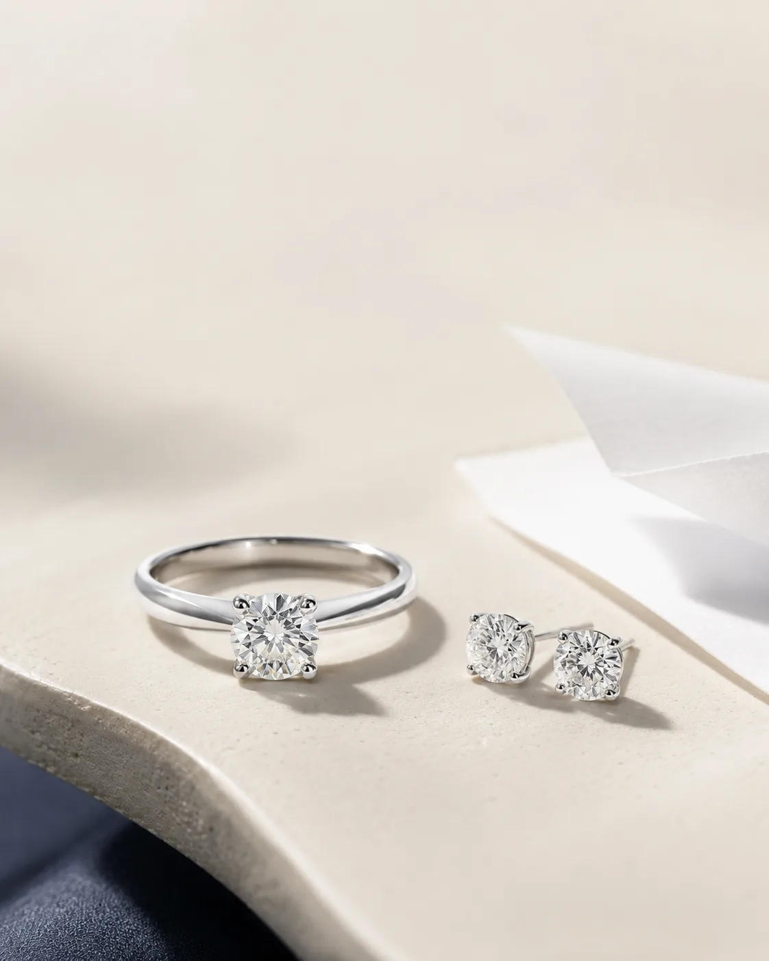 Natural diamond ring and stud earrings set in platinum