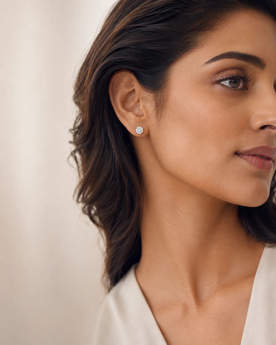Woman wearing a platinum diamond stud earring